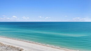 A beach with clear turquoise water and a white sandy shore. - NEW 15th Floor Gulf View - Balcony - Pool - Hot Tub (Pensacola Beach)
