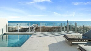 A pool area with a clear view of the beach and ocean. - Casita Bonita at Eleanor Beach (Pensacola)