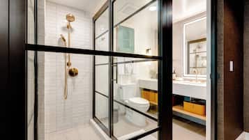 Combined shower/bathtub, designer toiletries, hair dryer, bathrobes