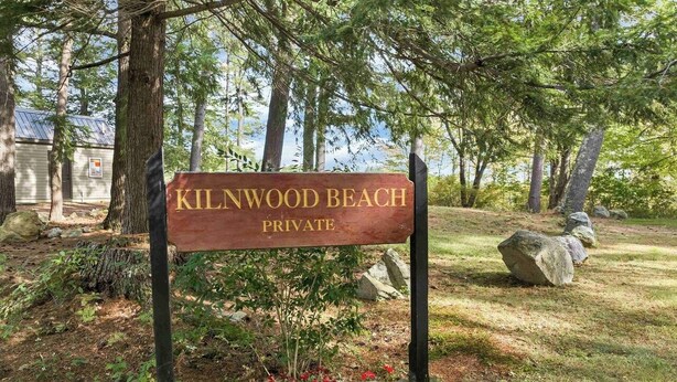 A wooden sign that reads "Kilnwood Beach Private." -  Lake Kanasatka - Private beach access. Your perfect vacation starts right here! (Moultonborough)