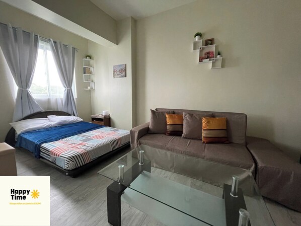 Living area - Cozy 1-bedroom condo in wonderful San Jose Del Monte Bulacan with AC and WiFi (San Jose del Monte City)