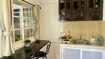 Comfort Apartment, 1 Queen Bed, Patio, Ground Floor | Private kitchen | Coffee/tea maker
