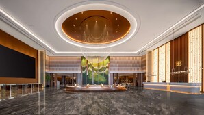 A spacious lobby with a central fountain, a large chandelier, and a reception desk. - Hilton Garden Inn Ordos Kangbashi (Ordos)