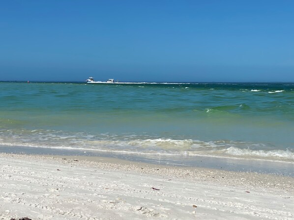 On the beach, sun loungers, beach towels