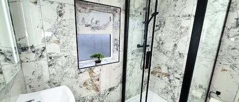 Shower, towels, soap, toilet paper