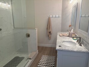 Shower, hair dryer, towels, soap