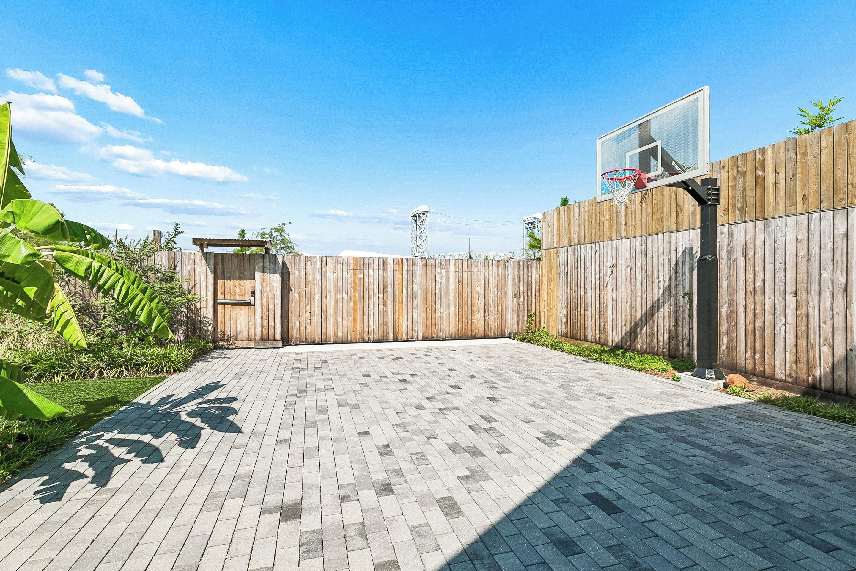 The basketball hoop on the driveway court.