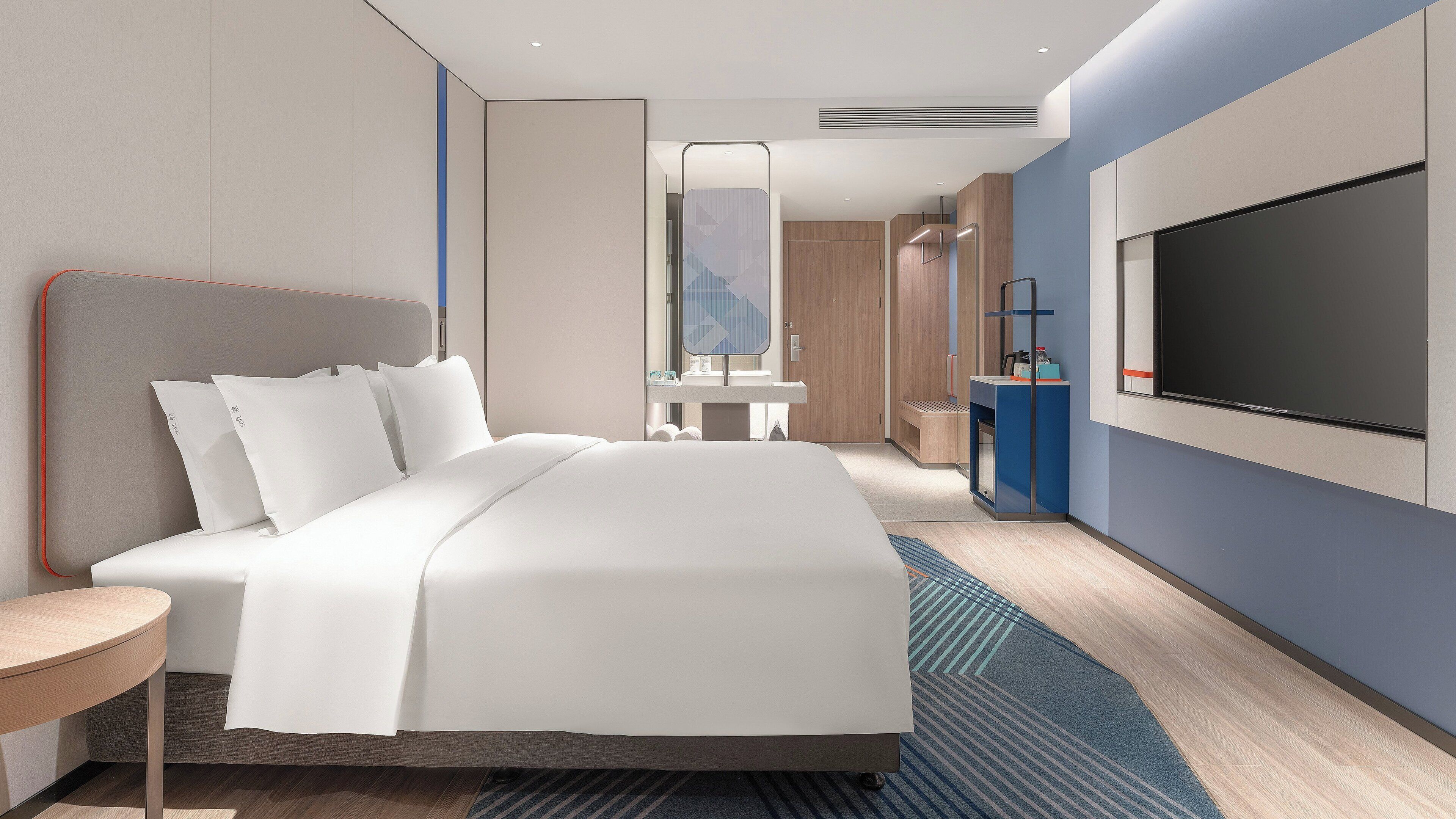 Seprai premium, selimut bulu angsa, dan ruang kerja ramah laptop