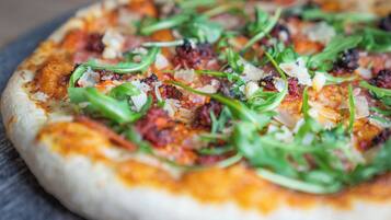 A pizza with toppings.