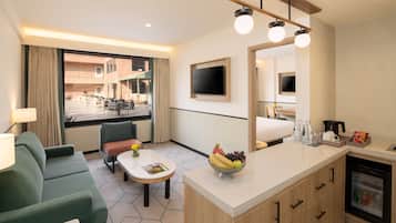 Suite, 1 Bedroom, Pool View | Down duvets, minibar, in-room safe, individually decorated
