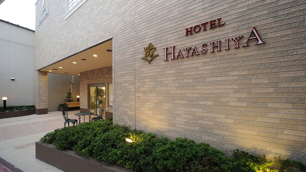 A hotel entrance with a sign reading 'HOTEL HAYASHIYA A' and a logo above the sign. - Hotel Hayashiya Ishinomaki (Isinomaki)