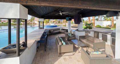 This GORGEOUS custom home is located on 3/4 acre waterfront in Gilbert Arizona