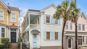A two-story house with a balcony, a front porch, and a mailbox. - The Philip's Suite, newly renovated 3 Bed/3 EnSuite Bath, 1 Block to King (Charleston)