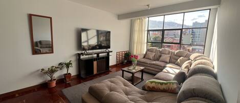 Junior Studio Suite, City View | Living area | 42-inch LCD TV with cable channels