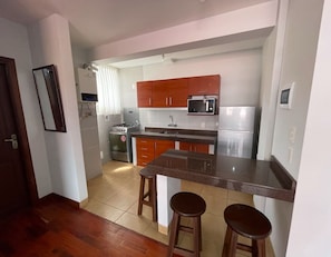 Junior Studio Suite, City View | Private kitchen | Mini-fridge, kitchen islands