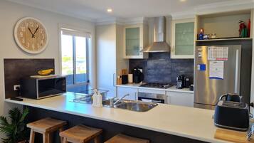 Microwave, dishwasher, coffee/tea maker, highchair