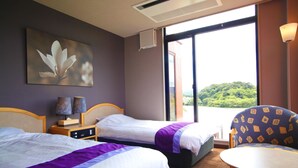 A hotel room with two beds, a table, a chair, a painting, and a view of a green landscape. - Hotel & Lakehouse Soka (Kyotango)