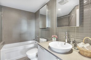 Hair dryer, towels, soap, toilet paper - Spacious Modern High-Rise with Ocean & City Views (Vancouver)