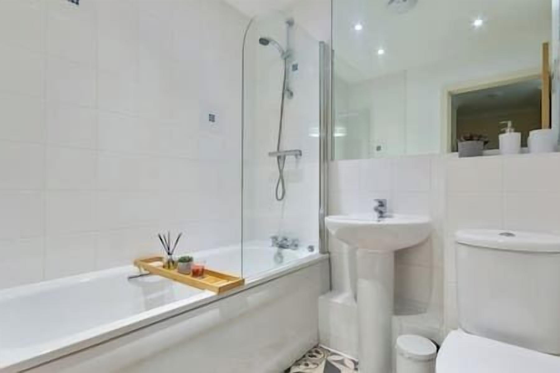 Shower, hair dryer, towels, toilet paper