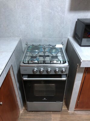 Fridge, microwave, stovetop, cookware/dishes/utensils