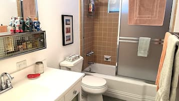 Combined shower/tub, hair dryer, towels, soap