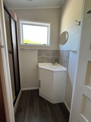 Shower, hair dryer, towels, soap