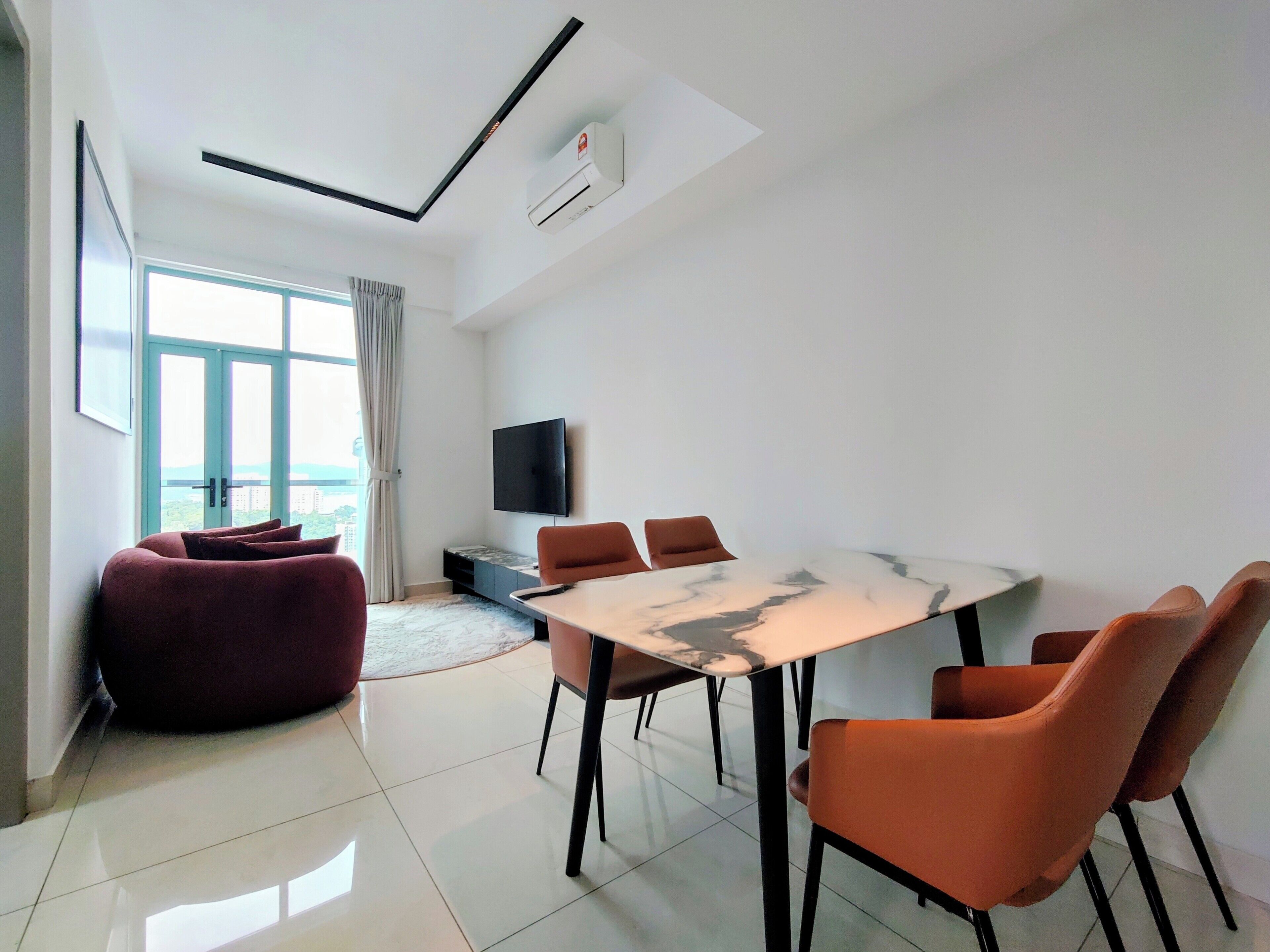 Deluxe Apartment, 2 Bedrooms, Balcony, City View | Living area | 55-inch Smart TV with digital channels