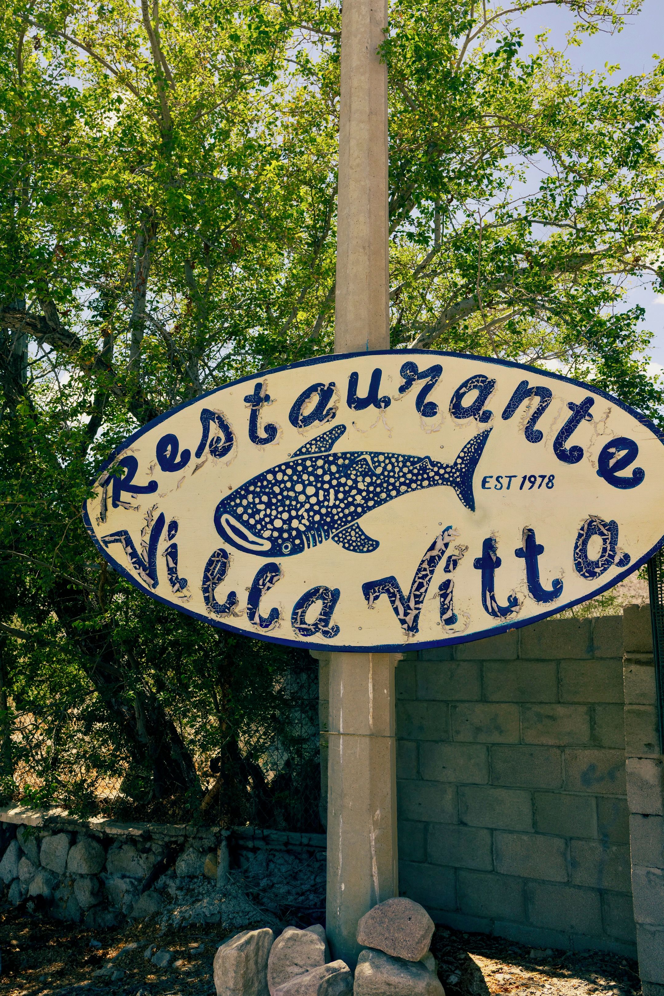 A restaurant sign with a shark design, established in 1978.