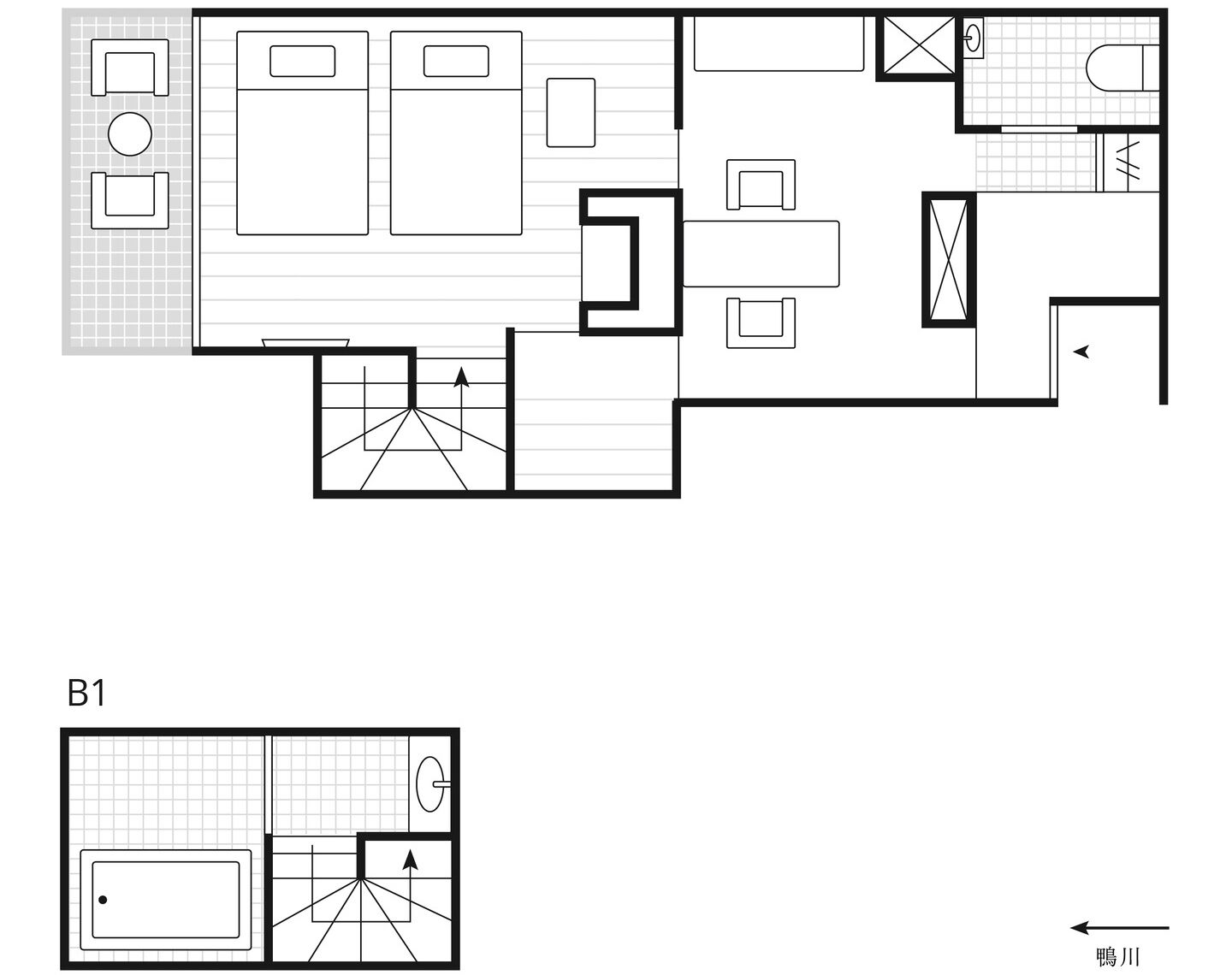 Een plattegrond van een hotelkamer, aangeduid met B1, met een badkamer, kitchenette en woonruimte.