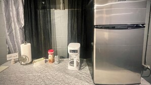 A kitchen with a stainless steel refrigerator, a coffee maker, and a paper towel holder. - Ranch House in peaceful Little Hocking close to the Ohio River. Heat/AC, WiFi (Little Hocking)