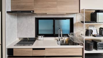 Family Condo, Balcony, Garden View | Private kitchen | Microwave, coffee/tea maker, electric kettle, toaster