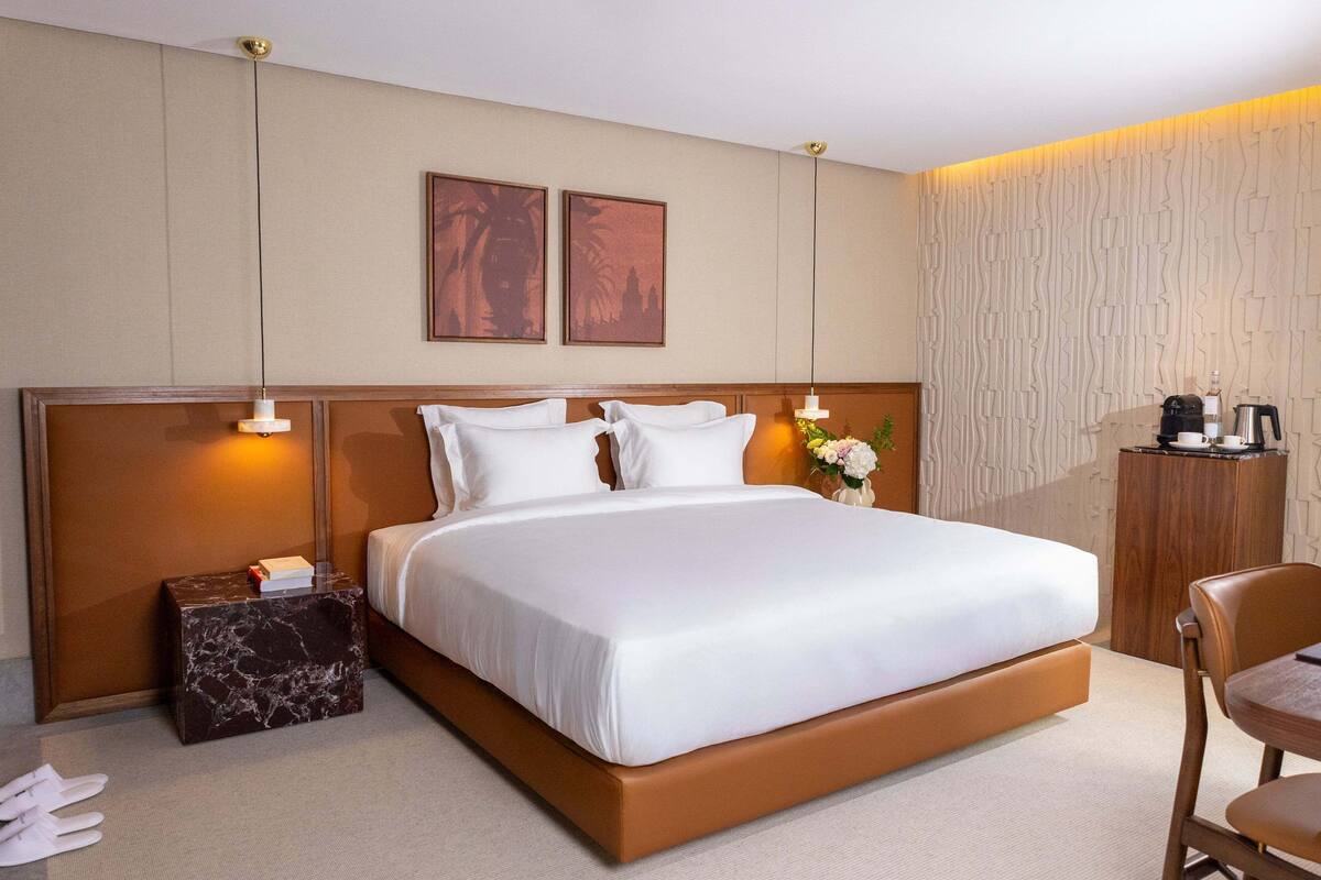 Superior Suite | 1 bedroom, in-room safe, desk, blackout drapes
