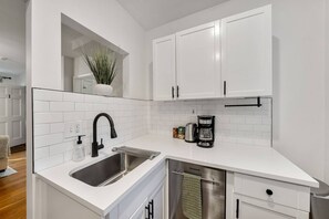 Fridge, microwave, oven, dishwasher - Historic Beacon Hill Charm: Modern Apt w/ Patio, High-Speed WiFi, Steps to Cafes and Boston Commons! (Boston)
