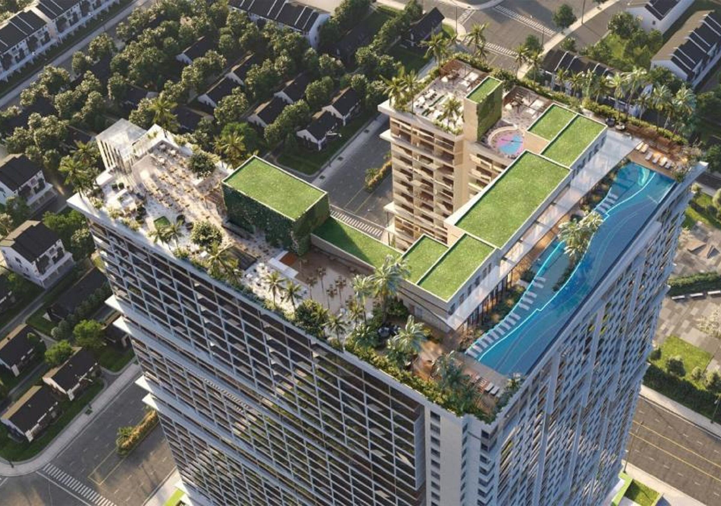 A high-rise building with a rooftop pool, a green roof, and a surrounding landscaped area.
