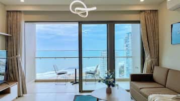 Deluxe Apartment, 3 Bedrooms, Sea View | Living area | 70-cm flat-screen TV with digital channels, foosball, table tennis