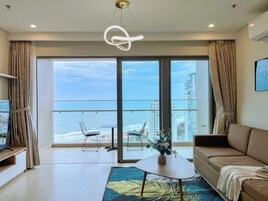 Deluxe Apartment, 3 Bedrooms, Sea View | Living area | 70-cm flat-screen TV with digital channels, foosball, table tennis