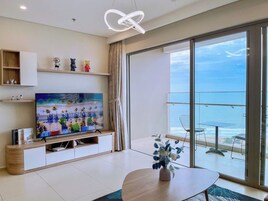 Deluxe Apartment, 3 Bedrooms, Sea View | Living area | 70-cm flat-screen TV with digital channels, foosball, table tennis