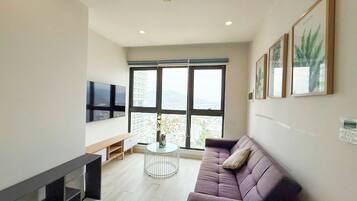 Apartment, 2 Bedrooms, Partial Ocean View | Living area | Netflix, streaming services