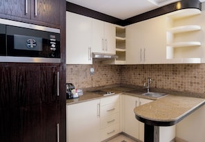Fridge, microwave, cookware/dishes/utensils