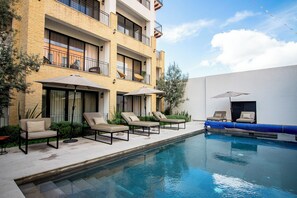 Outdoor pool, pool umbrellas, pool loungers