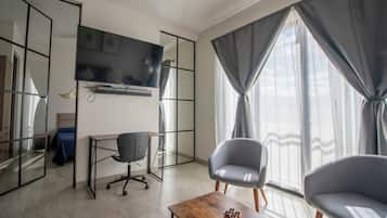 Appartement Deluxe | Coin séjour | Télévision