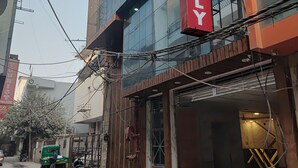 A building with a prominent red sign reading 'AEROFLY' and a visible entrance. - Room-nestled in New Delhi's Mahipalpur d (New Delhi)