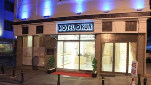 A hotel entrance with a sign reading "HOTEL OKUR". - OKUR OTEL (Istanbul)