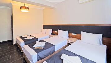 Standard Quadruple Room | In-room safe, desk, iron/ironing board, free WiFi