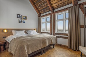 Habitación doble de lujo, vista al océano | Ropa de cama de alta calidad y artículos del minibar gratis 