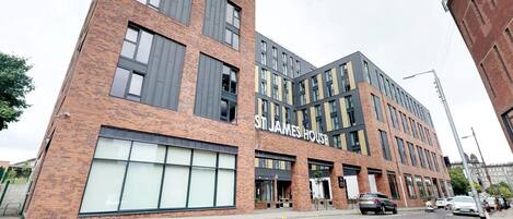 A multi-story building with a prominent sign reading "ST JAMES HOUSE".