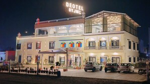 A hotel with a sign reading "DEOTEL BY JMC" and multiple balconies. - Deotel Inn Pithampur by JMC (Dr. Ambedkar Nagar)
