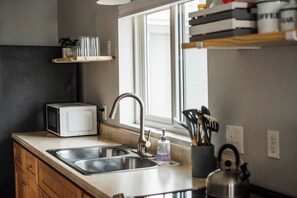 Fridge, coffee/tea maker, highchair, cookware/dishes/utensils