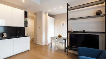 Deluxe Apartment, City View | Living area | 50-inch Smart TV with digital channels
