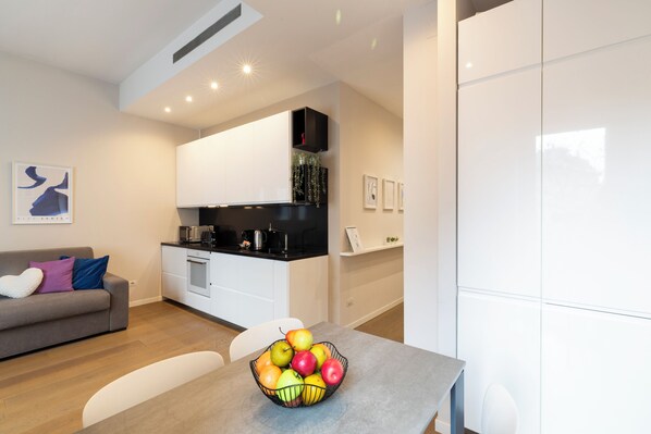 Deluxe Apartment, City View | Living area | 50-inch Smart TV with digital channels - notaMi - Arena Modern Apartment (Milan)
